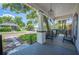 Charming covered front porch providing ample seating, an exterior ceiling fan and shaded comfort at 213 Cannon St, Lakeland, FL 33803