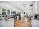 Stylish kitchen with stainless steel appliances, granite countertops, and an open layout to the dining area at 213 Cannon St, Lakeland, FL 33803