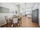 Open concept kitchen with a dining area, stainless steel appliances, and modern design at 213 Cannon St, Lakeland, FL 33803