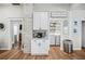 Convenient laundry area with granite countertops, washer, dryer, and ample storage space at 213 Cannon St, Lakeland, FL 33803