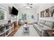 Bright living room with a decorative fireplace, neutral color palette, and ample natural light at 213 Cannon St, Lakeland, FL 33803