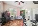 Bright office featuring an gaming chair, hardwood floors, and a view to a bathroom at 213 Cannon St, Lakeland, FL 33803