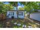 House with stone pavers and fenced yard, providing a cozy outdoor space at 213 Cannon St, Lakeland, FL 33803