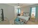 Serene bedroom with soft colors, ceiling fan, and comfortable furnishings at 2169 Rush Bay Way, Orlando, FL 32824