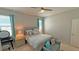 Comfortable bedroom featuring soft decor, ceiling fan, and ample natural light at 2169 Rush Bay Way, Orlando, FL 32824