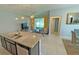 Gourmet kitchen showcases granite countertops, stainless steel appliances, and abundant natural light at 2169 Rush Bay Way, Orlando, FL 32824