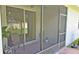 View of a cozy patio with seating, enclosed with screens, offering a relaxing outdoor space at 2169 Rush Bay Way, Orlando, FL 32824