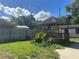 Backyard features a wooden gazebo perfect for outdoor relaxation and entertaining under a blue sky at 2250 Maple Hill Dr, Lakeland, FL 33811