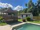 Backyard with in-ground pool and wooden gazebo, great for outdoor relaxation at 2250 Maple Hill Dr, Lakeland, FL 33811