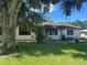 Cozy single-story home with a well-maintained lawn and mature tree in the front yard at 2250 Maple Hill Dr, Lakeland, FL 33811