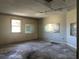 Spacious garage featuring natural light and ample room for parking or storage, ready for renovations at 2250 Maple Hill Dr, Lakeland, FL 33811