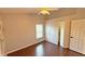 Cozy bedroom with wood floors, walk-in closet, a ceiling fan, and a bright window at 2264 Palmview E Cir, Auburndale, FL 33823