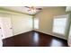 This bedroom features neutral paint and wood floors with plenty of natural light at 2264 Palmview E Cir, Auburndale, FL 33823