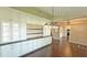 Dining room with built-in cabinets, hardwood floors, and stylish lighting fixtures that enhance the space at 2264 Palmview E Cir, Auburndale, FL 33823