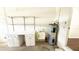 Functional garage space with a utility sink, storage cabinets, and a modern water heater at 2264 Palmview E Cir, Auburndale, FL 33823
