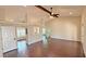 Open-concept living room boasts vaulted ceilings, wood floors, and lots of natural light at 2264 Palmview E Cir, Auburndale, FL 33823