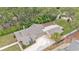 Aerial shot of a home with lush trees surrounding the property at 236 E Seminole Ave, Lake Wales, FL 33853