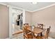 Dining room adjacent to kitchen featuring wood table and four chairs at 236 E Seminole Ave, Lake Wales, FL 33853