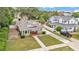 Charming single-story home featuring a well-manicured lawn, inviting front porch, and a spacious driveway at 236 E Seminole Ave, Lake Wales, FL 33853