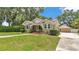Charming bungalow-style home with a well-maintained front yard and inviting red-brick front steps at 236 E Seminole Ave, Lake Wales, FL 33853