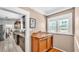 Charming kitchen with granite countertops and dark wood cabinets and view into dining room at 236 E Seminole Ave, Lake Wales, FL 33853