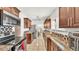 Kitchen featuring stainless steel appliances, granite countertops, and abundant cabinet space at 236 E Seminole Ave, Lake Wales, FL 33853