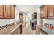 Bright kitchen featuring granite countertops and stainless steel appliances at 236 E Seminole Ave, Lake Wales, FL 33853