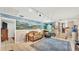 Cozy living room with decorative wall mural, comfortable seating and a traditional area rug at 236 E Seminole Ave, Lake Wales, FL 33853