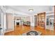 Spacious living room with hardwood floors, fireplace, built-in shelving, and elegant furnishings at 236 E Seminole Ave, Lake Wales, FL 33853