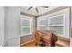 Charming home office with hardwood floors, vintage desk, and natural light from two windows at 236 E Seminole Ave, Lake Wales, FL 33853