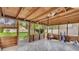 Enclosed sun room with tile floors and views of the surrounding yard and landscape at 236 E Seminole Ave, Lake Wales, FL 33853