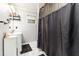 Elegant bathroom with white marble floors, modern vanity, and walk in shower, blending style and functionality at 2443 Delrose E Dr, Lakeland, FL 33805