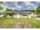 Charming single-story home with a well-maintained lawn and inviting front porch at 2443 Delrose E Dr, Lakeland, FL 33805