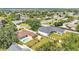Aerial view of home with fenced yard, pool and shed in a neighborhood with mature trees and lawns at 2533 Peterson Rd, Lakeland, FL 33812
