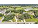 Aerial view showcasing the property, surrounding greenery, and nearby school facilities at 2533 Peterson Rd, Lakeland, FL 33812