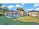 Spacious backyard with an in-ground pool and a covered patio at 2533 Peterson Rd, Lakeland, FL 33812