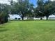 A spacious backyard with mature trees offers plenty of room for outdoor activities at 2533 Peterson Rd, Lakeland, FL 33812