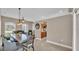 Bright dining room with pendant lighting open to the kitchen at 2533 Peterson Rd, Lakeland, FL 33812