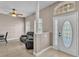 Inviting foyer with tile floors, column accents, and an elegant front door, leading into a cozy living space at 2533 Peterson Rd, Lakeland, FL 33812