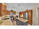 Beautiful kitchen featuring custom wood cabinets, stainless steel appliances, and an island with granite countertop at 2533 Peterson Rd, Lakeland, FL 33812