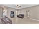 Cozy living area with neutral walls, two sofas and large windows, creating a warm and inviting atmosphere at 2533 Peterson Rd, Lakeland, FL 33812