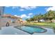 A sparkling pool with a well-manicured lawn provides a relaxing backyard oasis at 2533 Peterson Rd, Lakeland, FL 33812