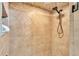 Tiled shower stall features a rain shower head and neutral color palette at 2533 Peterson Rd, Lakeland, FL 33812
