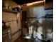 Unfinished basement space with storage shelving and utility hookups at 2921 Galaxy Ln, Lakeland, FL 33801