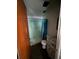 Bathroom features a stand-up shower, a white toilet, and a damaged vanity at 2921 Galaxy Ln, Lakeland, FL 33801