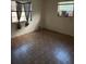 Bedroom features two windows, tile flooring, and painted walls at 2921 Galaxy Ln, Lakeland, FL 33801