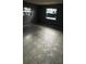 Bedroom features tile floors, two windows with black curtains, and painted walls at 2921 Galaxy Ln, Lakeland, FL 33801