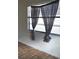 Bedroom features a window with dark curtains at 2921 Galaxy Ln, Lakeland, FL 33801