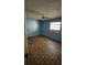 Bedroom features a ceiling fan, patterned floors, and a window at 2921 Galaxy Ln, Lakeland, FL 33801