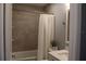 Bathroom with shower and tub, decorated with a calm zen-like vibe at 301 Orange Blossom Dr, Winter Haven, FL 33880